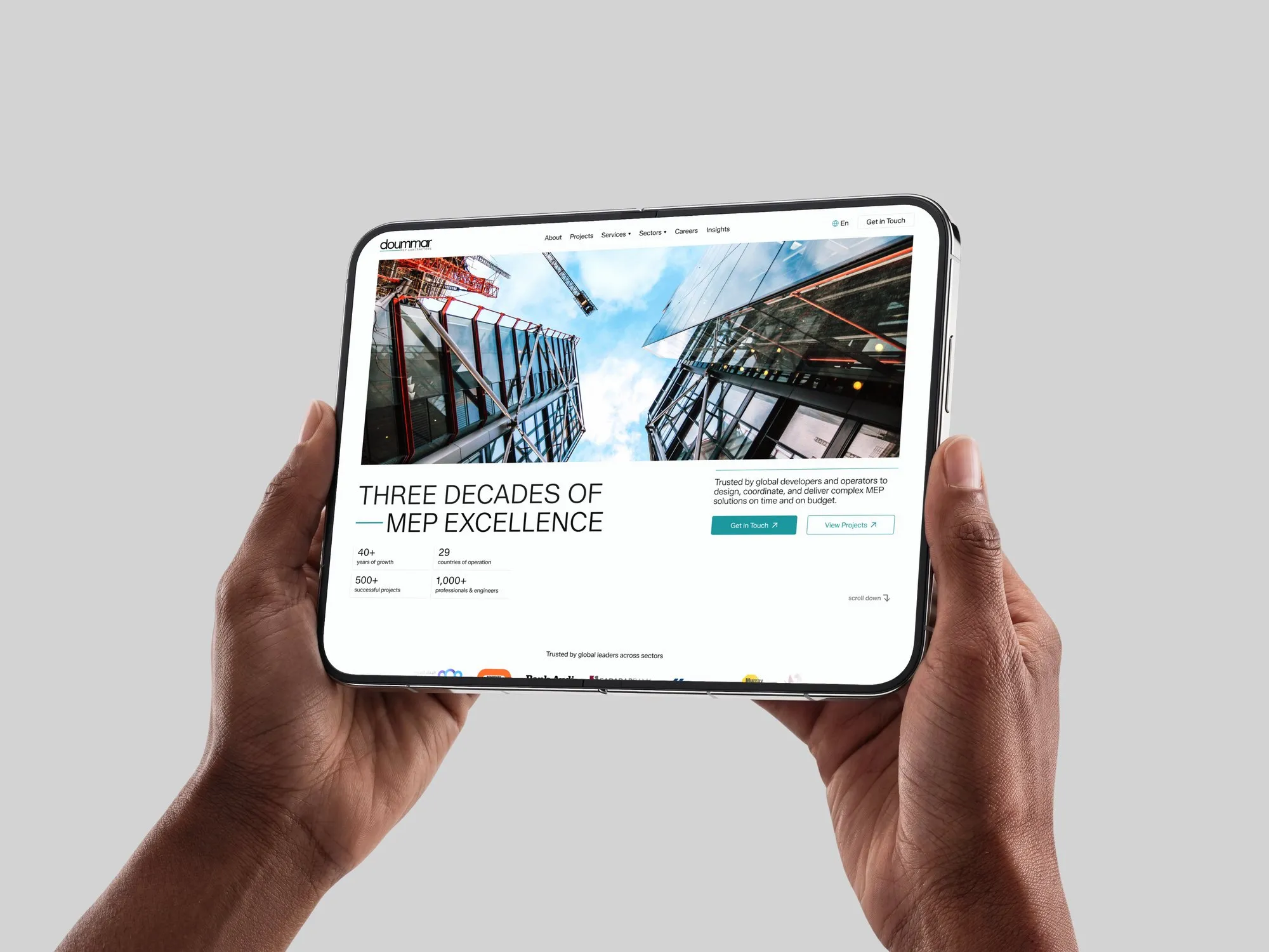 Doummar MEP Engineering website on a tablet